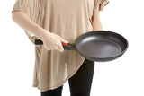 Woman holding cleverona fry pan with detachable handle