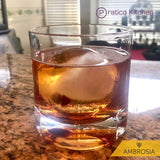 Whiskey on large whiskey glass with sphere ice 
