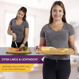 woman carrying large and lightweight bamboo cutting board